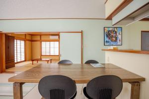a conference room with a wooden table and chairs at Twilight Villa Onjuku - Vacation STAY 52776v in Iwada