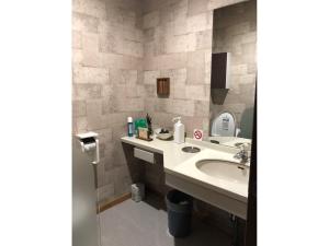 a bathroom with a sink and a mirror at Minshuku Cress - Vacation STAY 48561v in Biei +6 photos
