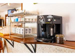 a coffee maker on a counter in a coffee shop at Nagura Village - Vacation STAY 61123v in Kabira