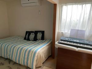 Postel nebo postele na pokoji v ubytování Oasis Wadaura - Vacation STAY 85741v