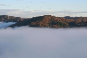 a view of a mountain in the middle of a lake at Washinosu Campground - Vacation STAY 85295v in Motegi