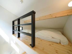 a bedroom with a bunk bed in a room at SENKO TINY CAMP - Vacation STAY 34705v in Ueda