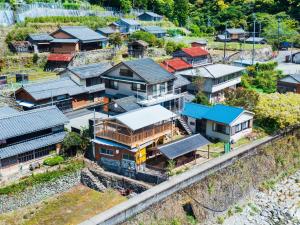 an aerial view of a village with houses at Goenza OYADO - Vacation STAY 86977v in Takinohai +8 photos