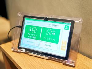 a small electronic device sitting on a table at Rakuten STAY VILLA Yatsugatake - 108 Simple Modern Pets Friendly - in Hokuto +50 photos