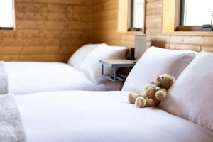 Giường trong phòng chung tại HERMANN Teddy Collectors' House - Vacation STAY 28475v