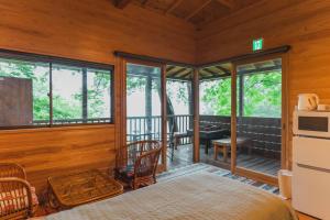a room with a bed and a balcony at Mahora Inahoyama - Vacation STAY 20484v in Minano