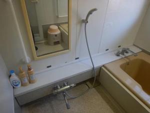 a bathroom with a shower and a sink and a tub at private villa Gifutakayama - Vacation STAY 26633v in Takayama +20 photos