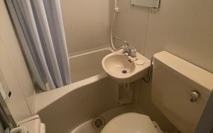 a small bathroom with a toilet and a sink at village yumigahama - Vacation STAY 49340v in Minato