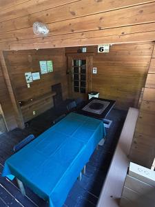 a room with a blue table in a wooden room at village yumigahama - Vacation STAY 49355v in Minato