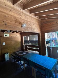 a dining room with a blue table and chairs at village yumigahama - Vacation STAY 49355v in Minato