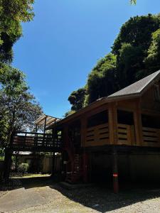 a wooden cabin with a porch and a deck at village yumigahama - Vacation STAY 49355v in Minato