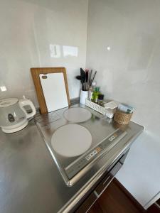 a kitchen counter with a sink and a appliance at On the hill ! ashitoku2 - Vacation STAY 14430 in Akaoki +13 photos