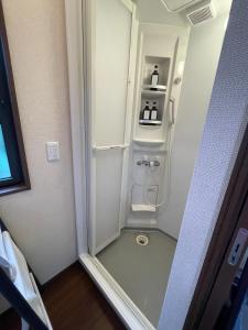a small white refrigerator in a room at On the hill ! ashitoku2 - Vacation STAY 14430 in Akaoki