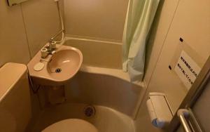 a small bathroom with a sink and a toilet at village yumigahama - Vacation STAY 49333v in Minato