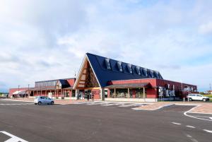 a large red building with a black roof at ＳＴＡＹ ＶＩＬＬＡ ＴＯＢＥＴＳＵ - Vacation STAY 14496 in Tōbetsu