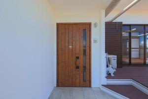 a wooden door on the side of a building at Harbor front JIRAMA 1 - Vacation STAY 14658 in Suno +41 photos