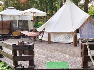a tent and a hammock on a wooden deck at Minamiaso STAYHAPPY - Vacation STAY 28451v in Shimoda +13 photos