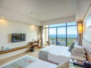 Postel nebo postele na pokoji v ubytování Galaxy Bay Resort + 213 fotografií