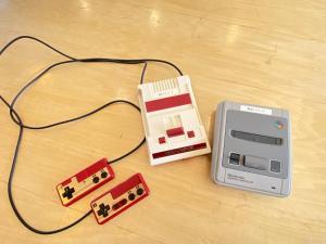 a electronic device sitting on top of a wooden floor next to a charger at Tateyama Retreat - Vacation STAY 44033v in Tateyama