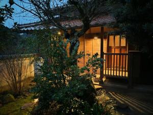a small house with a tree in front of it at Ryokuinsansou-bettei - Vacation STAY 48641v in Yasugi