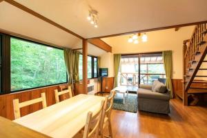 a living room with a table and a couch at Farm Inn Neba - Vacation STAY 42194v in Urugi