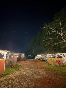 a group of vehicles parked in a parking lot at night at NAT PARK - Camp - Vacation STAY 42069v in Iwada +10 photos