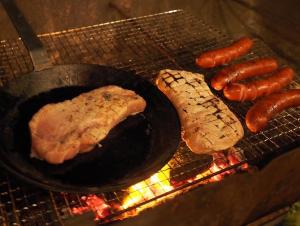 a grill with some meat and sausages on it at NAT PARK - Camp - Vacation STAY 42069v in Iwada