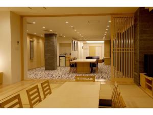a large living room with a table and chairs at Atami Spa & Resort - Vacation STAY 14644 in Atami