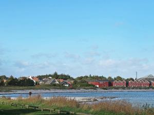 a view of a river with houses and buildings at 8 person holiday home in Hadsund-By Traum in Øster Hurup