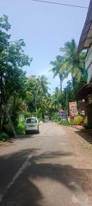 a car parked on the side of a street at selfia guest house in Majorda