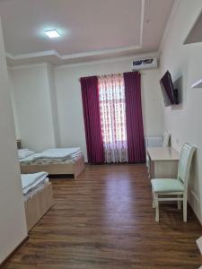 Ένα ή περισσότερα κρεβάτια σε δωμάτιο στο Pearl khiva hotel