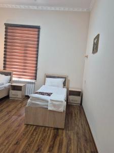 Ένα ή περισσότερα κρεβάτια σε δωμάτιο στο Pearl khiva hotel