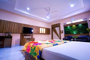 TV a/nebo společenská místnost v ubytování Wonder World Water Park And Resort