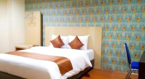 Кровать или кровати в номере Eljie Hotel