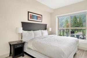 Ένα ή περισσότερα κρεβάτια σε δωμάτιο στο 3BR Lakeside Unit in Harrison