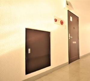 a flat screen tv on a wall next to a door at E-Horizon Kita 2 Jo Building - Vacation STAY 14740 in Sapporo