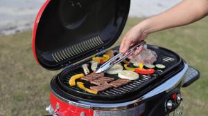 a person cooking meat and vegetables on a grill at amazing view room 2 - Vacation STAY 66244v in Kushima