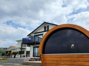 a house with a large window in front of it at Ocean Resort Tateyama T House - Vacation STAY 69839v in Tateyama +6 photos