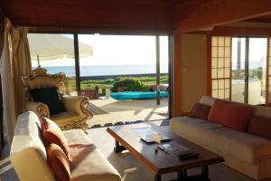 a living room with a couch and a table at Ocean Resort Tateyama T House - Vacation STAY 69839v in Tateyama