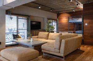 a living room with a couch and a table at Sun Mall 3rd Mansion 602 - Vacation STAY 14779 in Tokyo