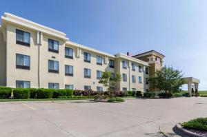 a large apartment building with a parking lot at Comfort Suites Salina South in Salina