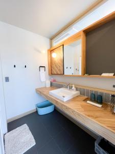 a bathroom with a sink and a large mirror at YUZUKI - Vacation STAY 92921v in Takamatsu