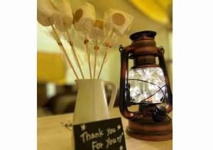 a wooden table with a vase and a jar with sticks at Keisaji CAMP SITE - Vacation STAY 90073v in Ijinabaru