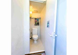 a bathroom with a toilet in a small room at Keisaji CAMP SITE - Vacation STAY 90073v in Ijinabaru