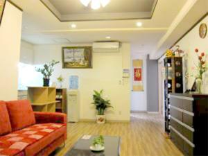 a living room with a couch and a table at GuestHouse FUKUTOMI - Vacation STAY 95744v in Makishimachi