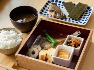 a lunch box with rice and food on a table at ZIPANG - Vacation STAY 20291v in Matsue