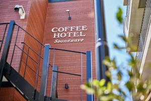 a sign that reads coffee hotel soundwave on the side of a building at COFFEE HOTEL Soundwave - Vacation STAY 17824v in Fujisawa