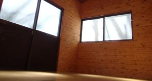 an empty room with a door and two windows at Toukaen campsite - Vacation STAY 23958v in Uenohara