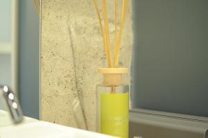 a bottle with bamboo sticks in it sitting on a counter at Yoshidamura VILLAGE - Vacation STAY 23964v in Horigome