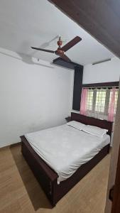 En eller flere senge i et værelse på Green House Resort